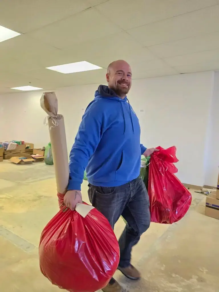mover carrying Christmas gifts