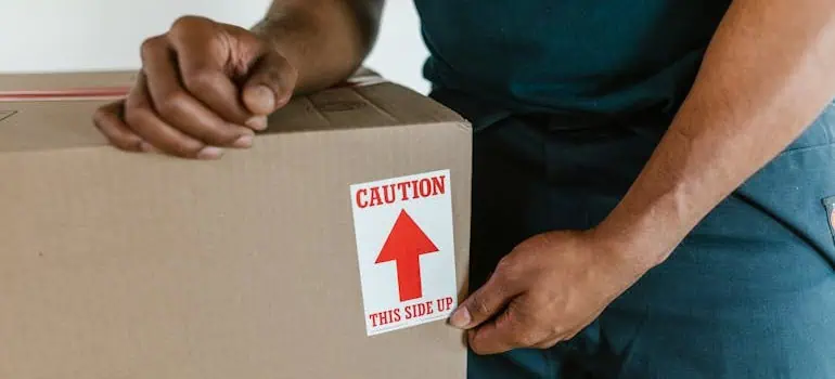The ultimate office move checklist for Ohio businesses 2 expert movers following the office relocation checklist and taping the box correctly