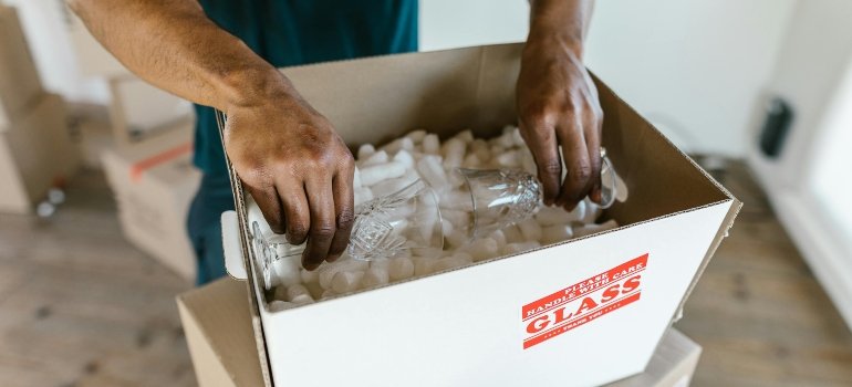 Professional movers carefully handling expensive items during a move.