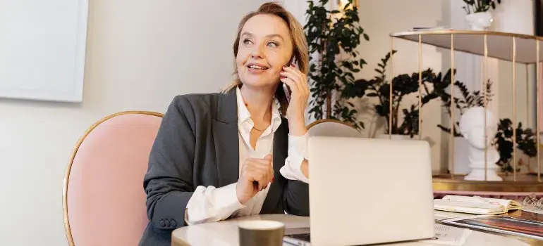 Why are families moving to West Chester Ohio? 7 Woman Talking on Phone at Work