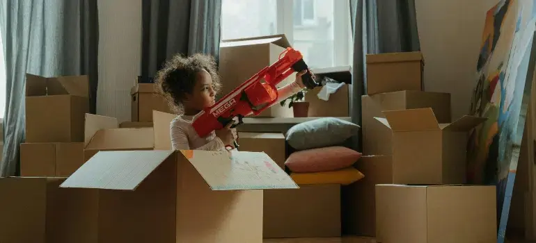Is Harrison Ohio a Nice Place to Live? 1 a kid playing with moving boxes