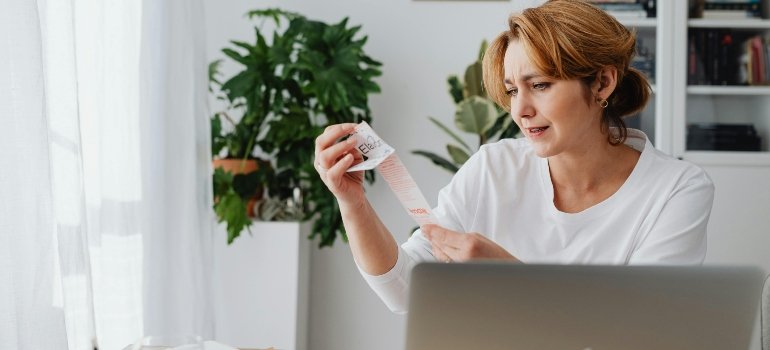 Woman Sitting Behind a Desk before moving to Ohio