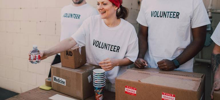Volunteers distributing supplies at a community drive