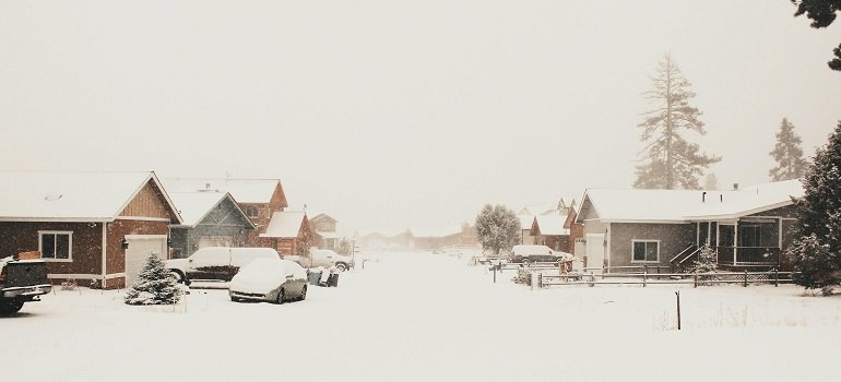 Neighborhood with steep hills and icy streets during December moves