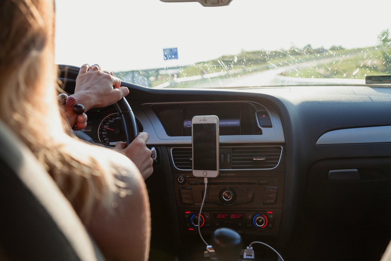 a girl driving a car