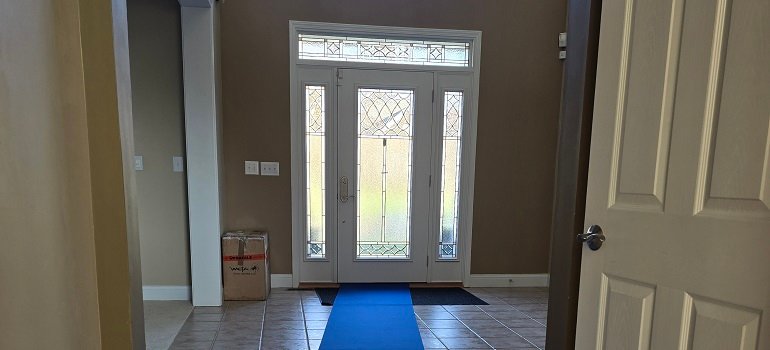 Protected entryway with floor runner during moving day.