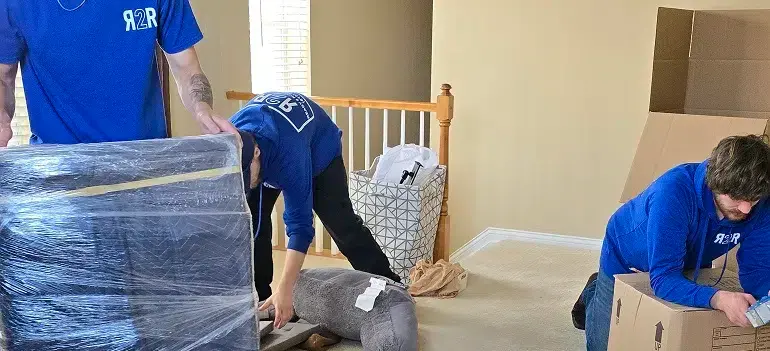 Tackling hoarding before a move 2 professionals sorting hoarding before a move in crowded living space