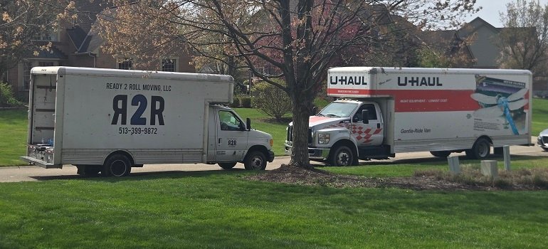 Your spring guide to moving to Morrow 2 Two moving trucks parked in suburban neighborhood