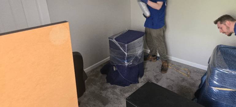 Packing supplies you should never skip for a long distance move 3 a man packing household items