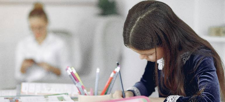 Girl studying at desk in new classroom