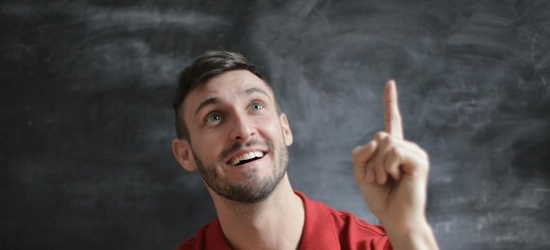 a man pointing up