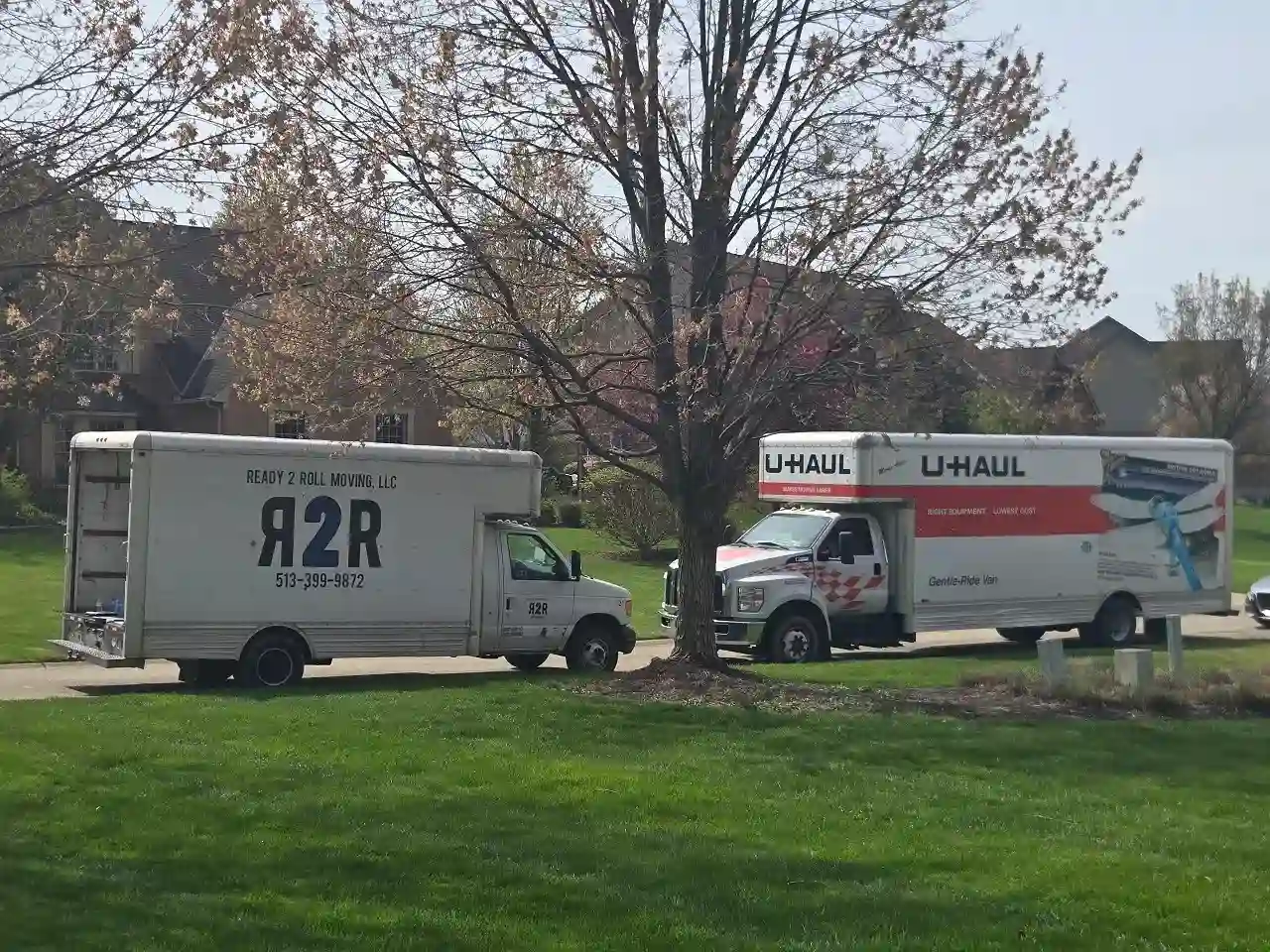 Moving trucks in driveway for family moving to Milford OH