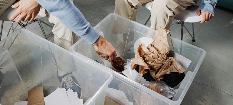People sorting leftover packing materials after moving to Cincinnati