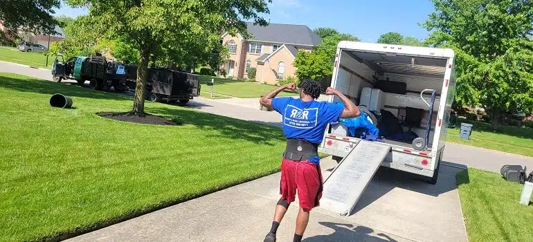 Commercial vs residential movers in Cincinnati: Which do you need? 1 Mover loading truck for suburban home move