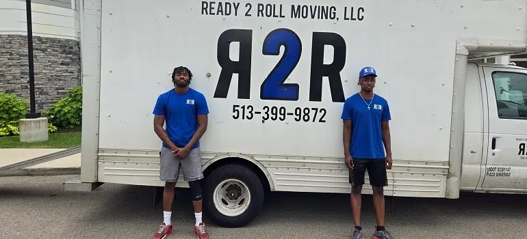 Residential Movers 4 two Cincinnati residential movers in blue Ready 2 Roll t-shirts