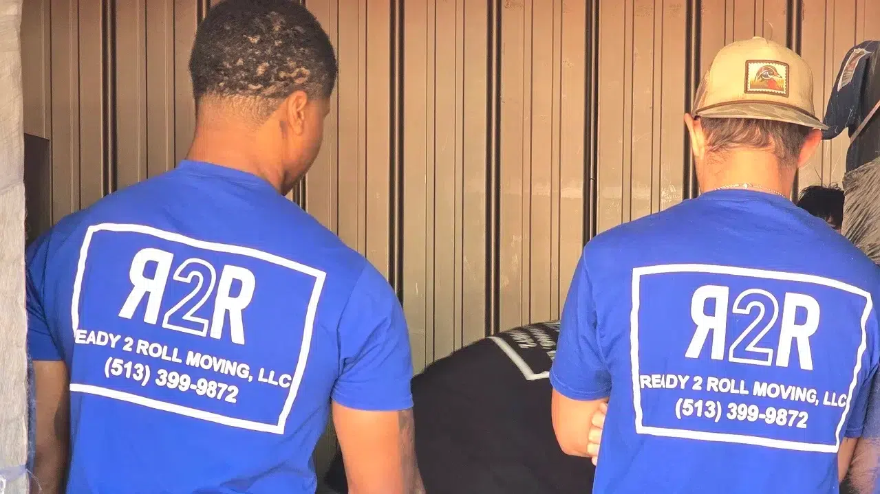 two professional movers in a moving truck