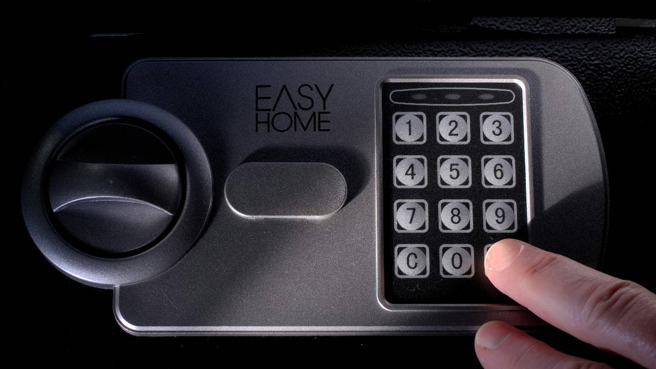 a person entering a code so that they can move a bolted-down safe in Cincinnati