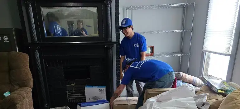 Movers packing boxes during a local relocation under apartment lease terms in Cincinnati.