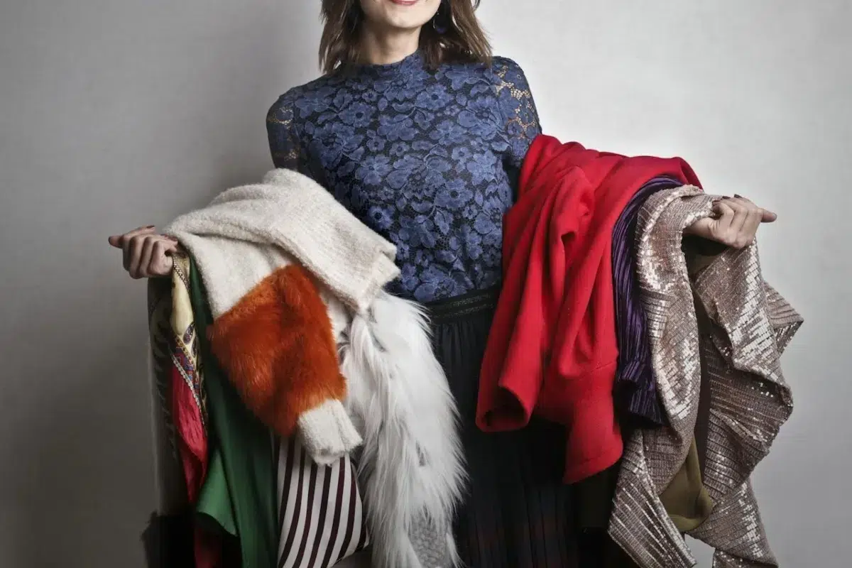 a woman thinking about how to pack clothes for moving