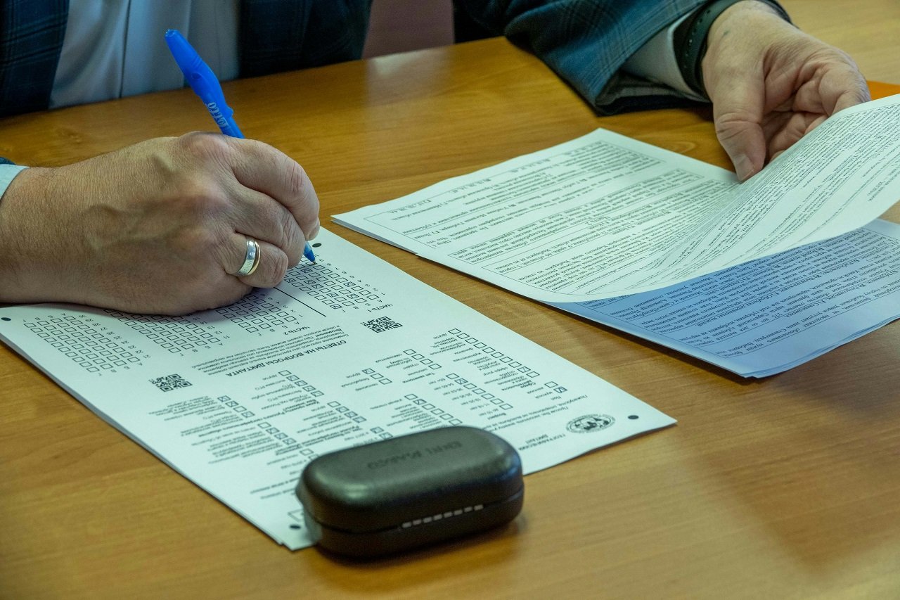 a man filling out paperwork for moving to West Chester OH from out of state