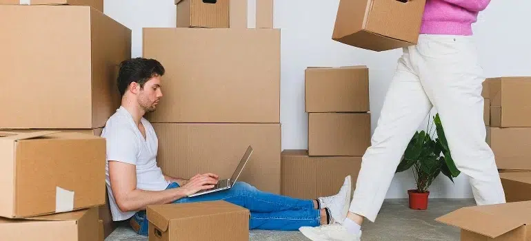 The Ultimate Moving Checklist for Relocating to Cincinnati 2 A couple is preparing for relocation by following the ultimate moving checklist.