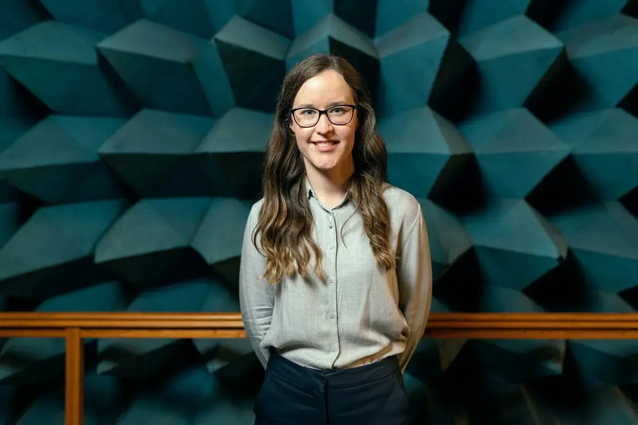 a young professional posing for a picture