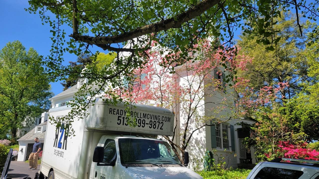 a moving van in front of a home