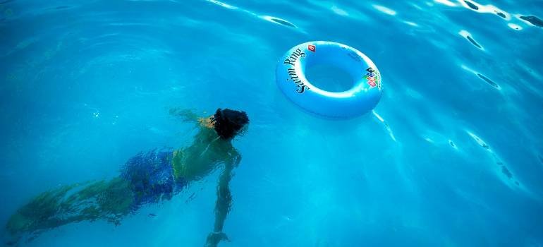 7 essential tips for moving into a new-build home in Mason OH 3 a person swimming in a pool