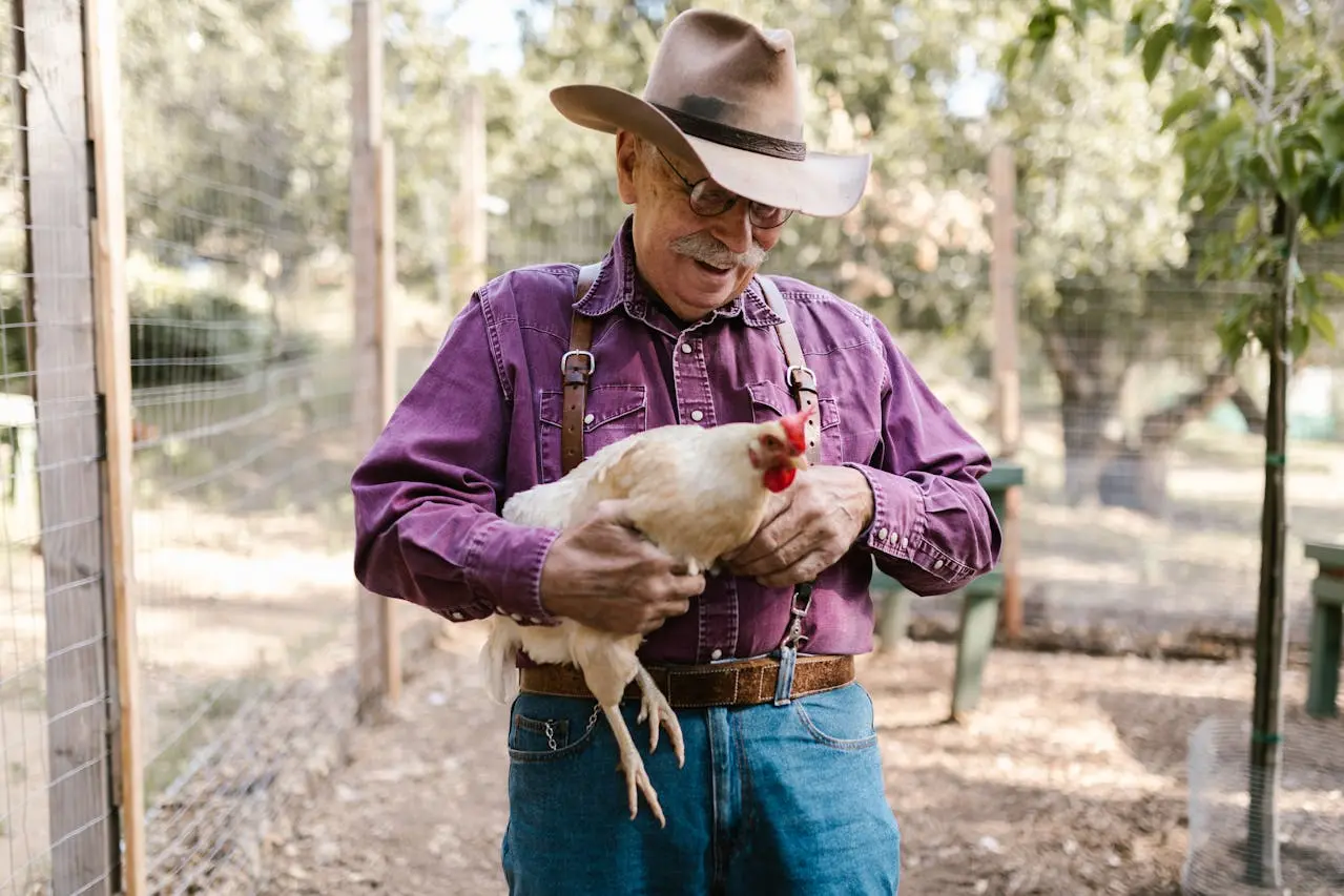 a man holding a chicken