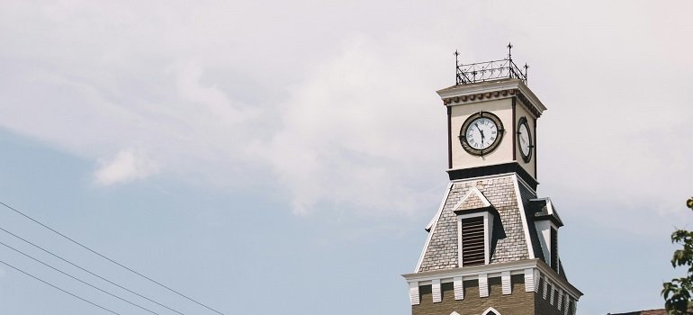 Cost and tips for moving to Lebanon Ohio this summer 1 Historic Lebanon clock tower against cloudy sky