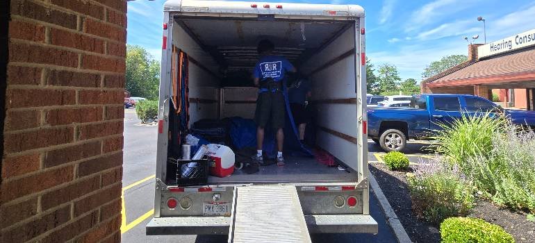 What not to pack when moving to Cincinnati 4 Movers loading a truck with items that show what not to pack when moving in Cincinnati