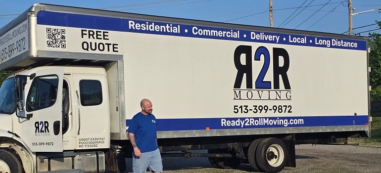Montgomery Movers 3 Ready 2 Roll mover beside company moving truck