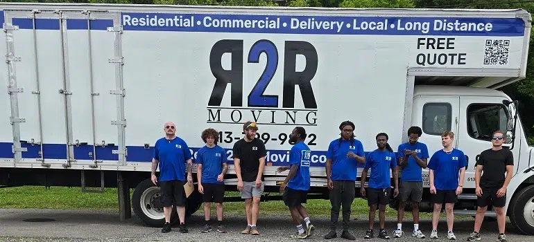 Monroe Ohio movers standing beside Ready 2 Roll truck